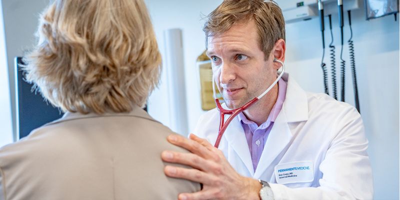 Daniel Kopp, MD, Family Medicine NWP physician meets with a patient